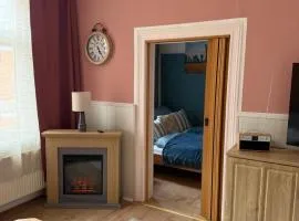 Haus HarzZauber - Historisches Altstadt Appartement mit Kamin und komfortabler E-Bike-Nutzung