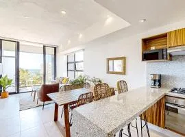 Ocean-view condo with infinity pool, rooftop lounge, & private balcony