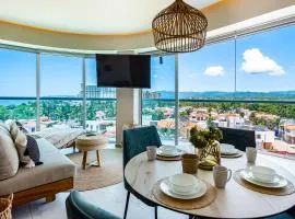 Ocean-view condo with balcony, central AC, pool, gym, cinema, & bar