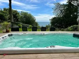 Stunning property with sea views and heated swimspa