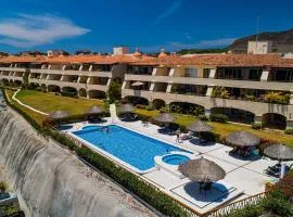 Stylish apartment near beach & dining with pool, hot tub, tennis, & large patio