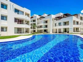 Spacious condo with near the beach with resort-style pool, inviting balcony
