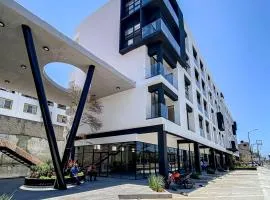 Ocean-view condo with infinity pool, rooftop lounge, & private balcony