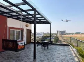 Runway Retreat Rooftop Swing, Airport View