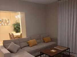 Two rooms and a lounge overlooking the Narcissus Hotel and the Kingdom Tower