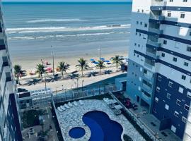 Apartamento pé na areia com 3 piscinas para família aceito pet, hotel a Mongaguá