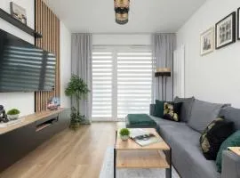 Modny Apartament z Parkingiem i Balkonem by Noclegi Renters