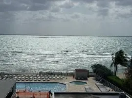 Direct ocean view condo with private balcony pool beach access Wi-Fi and amazing sunrise views Perfect for a relaxing vacation by the ocean