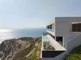 Seafront Cliff Villa with Infinity Pool & Wellness, By ThinkVilla