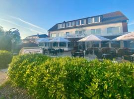 Strandhotel Deichläufer โรงแรมในบุทยาดิงเงน