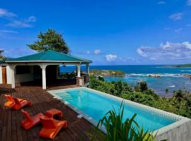 Sea Cliff Eco-Cottages & Gin Distillery, hotel din Calibishie