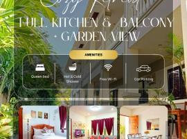 Retreat to a Stylish Flat w/ Balcony + Garden View, hotel a Liloan