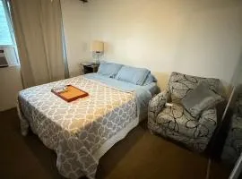 SHARE with working host, WiFi, AC, Pool, walk to Downtown, 15 min to airport