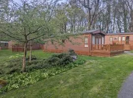 Park lodge in peaceful wooded glade