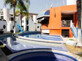 Capital O Hotel Partidor Del Sol，奧克斯特派克的飯店
