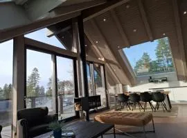Naava Chalet 401 Penthouse - Järvinäköala ilta-aurinkoon