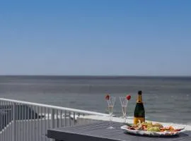 Coastal Comfort with Ocean Views from Shared Rooftop and Separate Pool