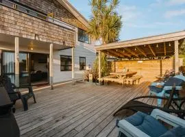 Waterfront location with estuary outlook and ocean beach access - sleeps 19