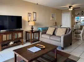 Spacious condo with views of the gulf near beaches features shared pool
