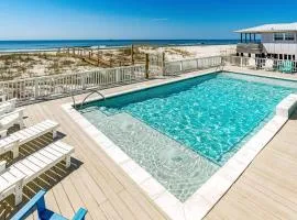 Completely renovated oceanfront home with shared outdoor pool views & balcony