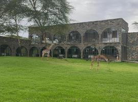 Giraffe Manor Tanzania, hôtel à Usa