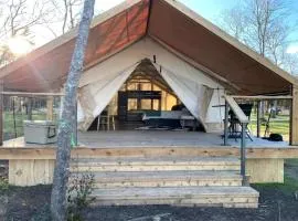 Relaxing Lakeview Safari Tent with Outdoor Seating and Nature Access near Bastrop, Texas