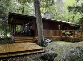 Cozy Cottage Surrounded by Trees with Private Dock for a Peaceful Escape by Big Moose Lake in New York