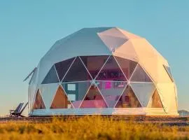 Luminous Cozy Dome with a Barbie Collection Above Bed in Willcox, Arizona