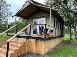 Romantic Lakefront Cabin with Fire Pit near Lake Bastrop, Texas – Luxury Glamping Escape for Couples