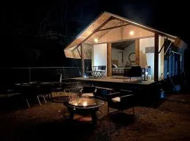 Beautiful Lakefront Glamping Cabin with Fire Pit and Lake Views near Austin, Texas