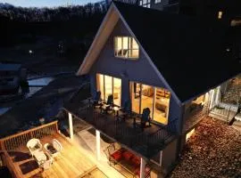 Secluded A-Frame Lakefront with Sun Deck and Sauna