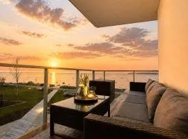 LUXURY WATERFRONT APARTMENTS WITH SEA VIEWS, SUNSET TERRACES and FREE PARKING, ONE WITH A HUUM SAUNA, THE OTHER WITH A BATHTUB