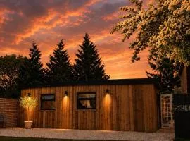 Cosy Canal-side lodge with log burner