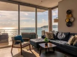 Luxury condo with balcony and front ocean view