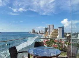 Luxury condo with balcony and front ocean view