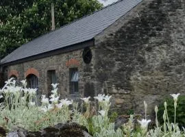 Historic Stone Cottage at Legan Castle Farmhouse with Hot Tub