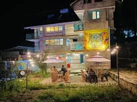 Wander Nest Manali Luxurious rooms with mountain peaks and waterfall view