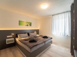 Aparthotel Neckartal - Premium Serviced Apartments mit je 2 Doppelzimmern - Highspeed-WLAN, 55'' Smart-TV in jedem Zimmer, Vollküche, Klima, Balkon, Parkplatz - 15 Min nach Stuttgart, Ludwigsburg & Waiblingen - die perfekte Basis für Business & Privat!, Hotel in Remseck am Neckar