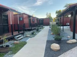 Red Cabins on Cordial Lane