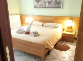 Bernina Express Apartment Il cuore di Lara e Stefy right in front of the train station, with garden and free parking