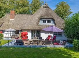 Weiße Reetdachkate Wohnung 1
