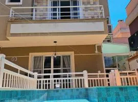 Casa moderna com piscina aquecida ar condicionado perto do centro e do aeroporto