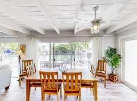 Waterfront home with 60-foot dock & beautiful patio - walk to beach