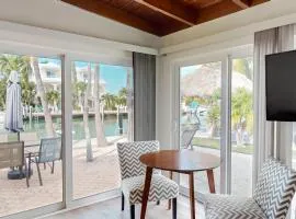 Beachy getaway with pool, water views, furnished patio, & dock access
