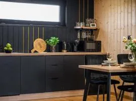 Holiday home with access to a pool, sauna, jacuzzi