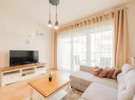 Cozy Apartment Near the Beach with Parking and Balcony in Pogorzelica by Noclegi Renters