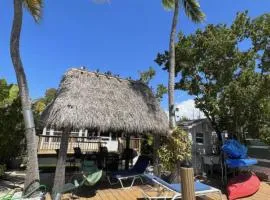 Waterfront Tiny House w Pool, Beach, and Boat Dock