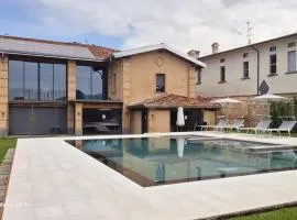 Elegant suite with porch and shared pool