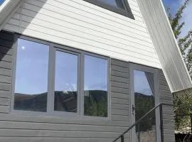 A frame house with a view of mountains
