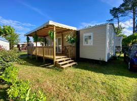 MOBIL-HOME "B30" tout confort avec piscine & lave-linge gratuit, hotel i Mimizan